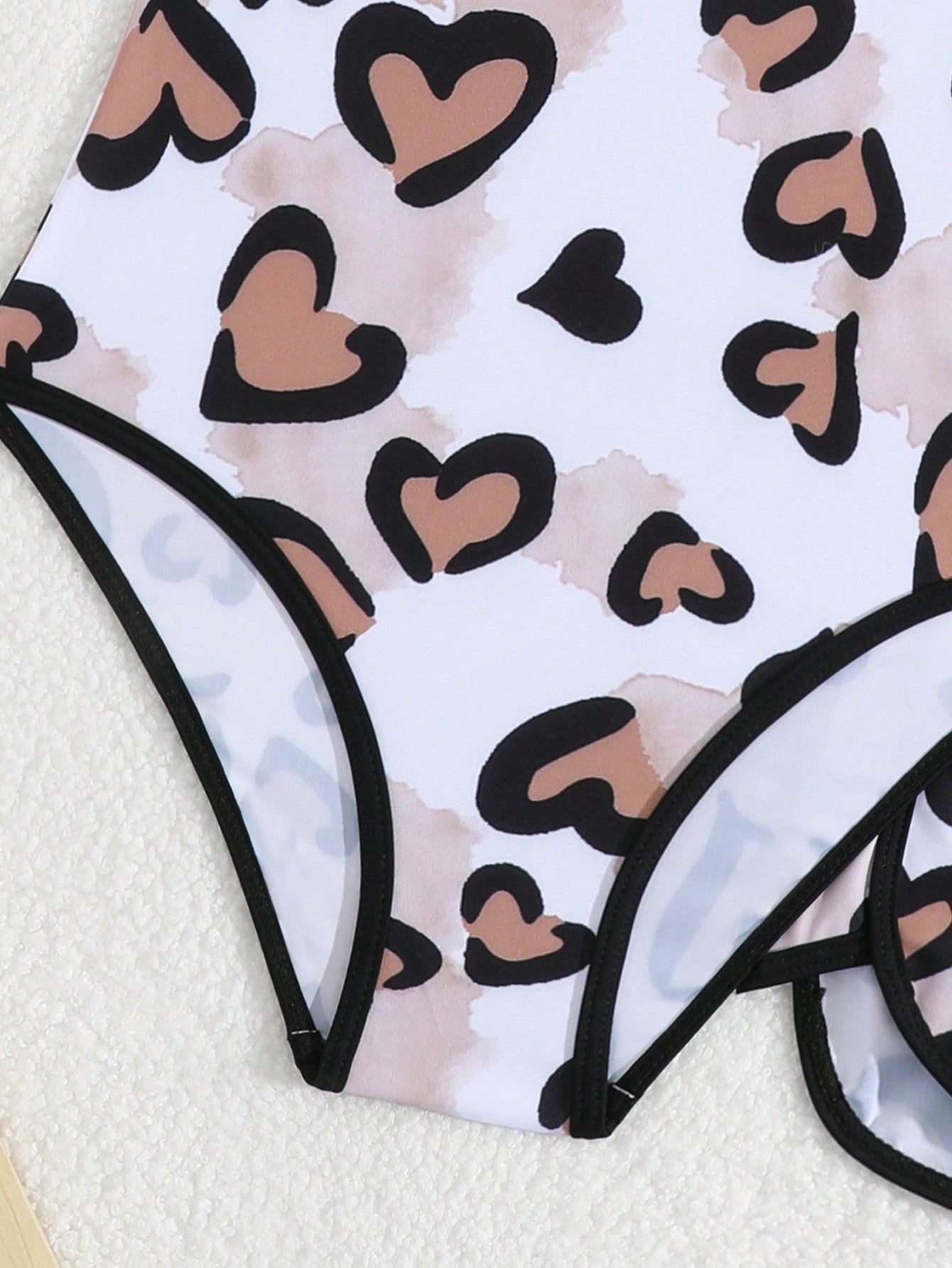 Girls 2-piece swimwear set featuring a butterfly print halter swimsuit top and separate mid-waist shorts in multicolor.