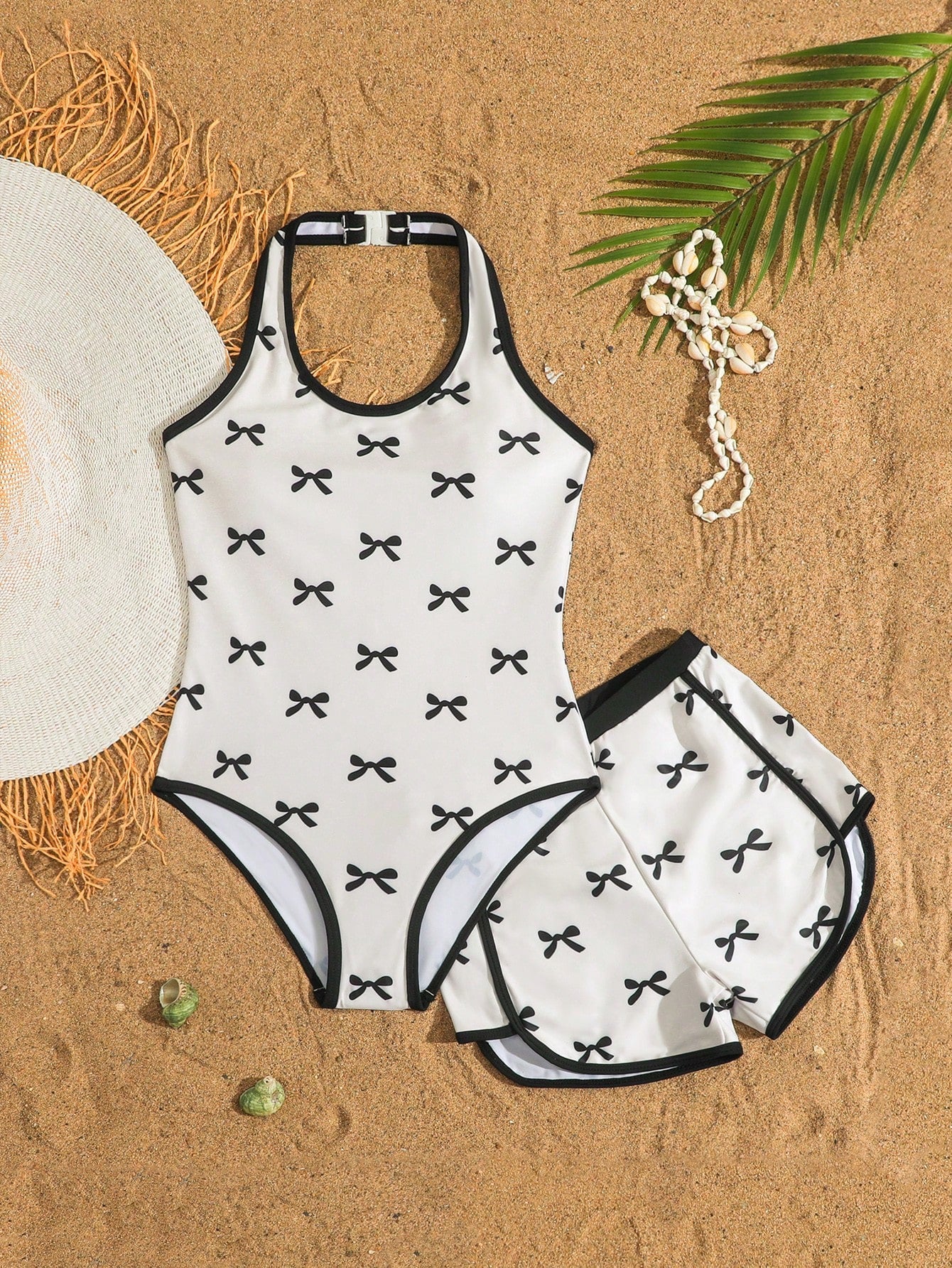 Girls 2-piece swimwear set featuring a butterfly print halter swimsuit top and separate mid-waist shorts in multicolor.