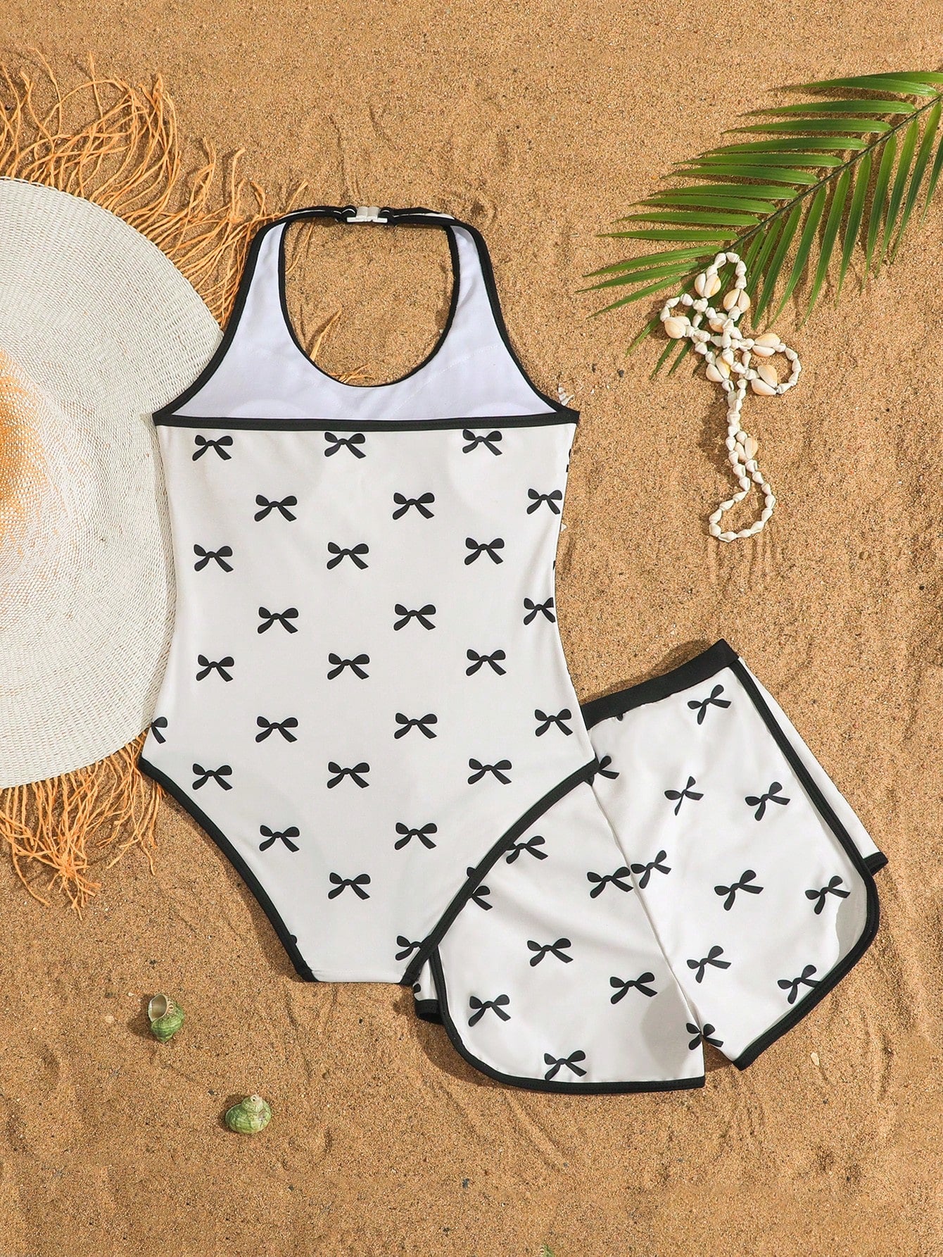 Girls 2-piece swimwear set featuring a butterfly print halter swimsuit top and separate mid-waist shorts in multicolor.