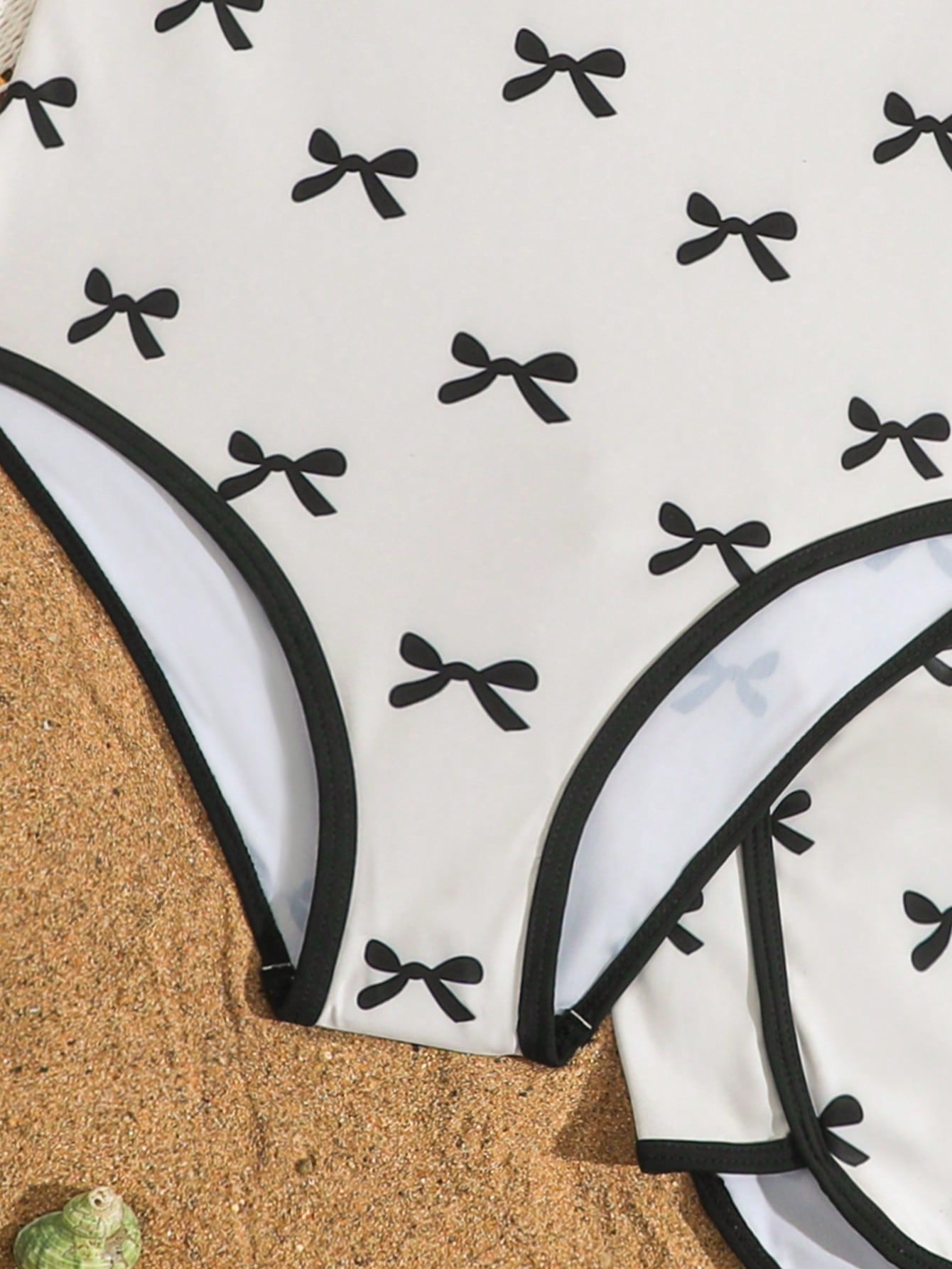 Girls 2-piece swimwear set featuring a butterfly print halter swimsuit top and separate mid-waist shorts in multicolor.