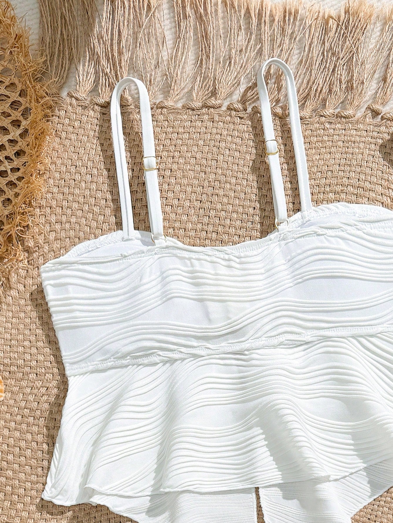 Tween girls two-piece tankini swimwear set with spaghetti straps, asymmetrical design, and 3D rose detail. Features a plant-pattern top and mid-waist bottoms in stretchy fabric for beach or pool wear.
