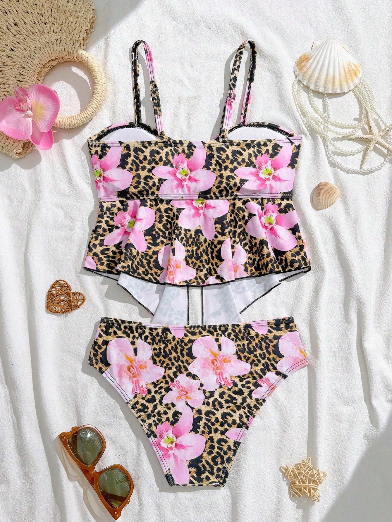 Tween girls two-piece tankini swimwear set with spaghetti straps, asymmetrical design, and 3D rose detail. Features a plant-pattern top and mid-waist bottoms in stretchy fabric for beach or pool wear.