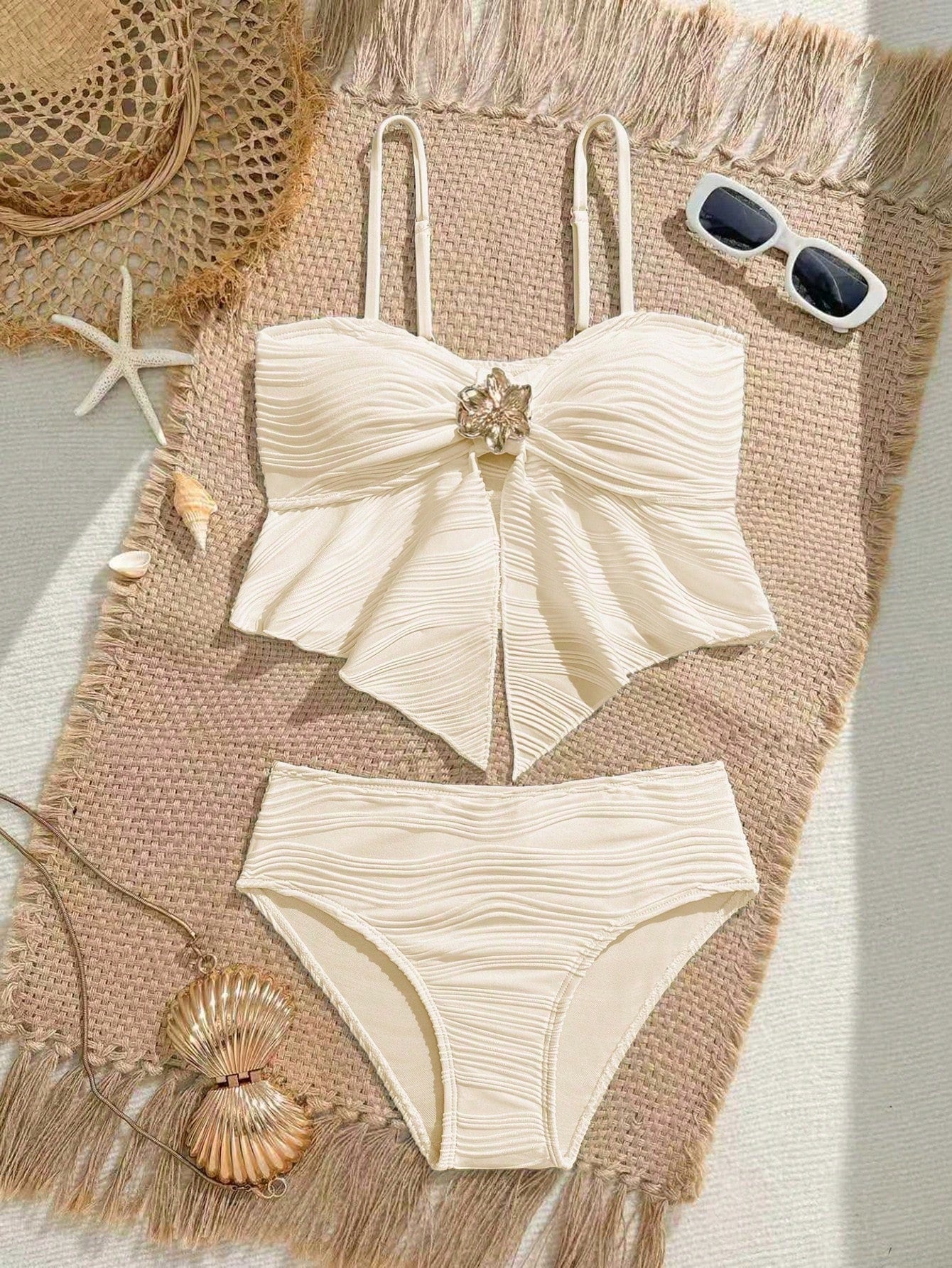 Tween girls two-piece tankini swimwear set with spaghetti straps, asymmetrical design, and 3D rose detail. Features a plant-pattern top and mid-waist bottoms in stretchy fabric for beach or pool wear.