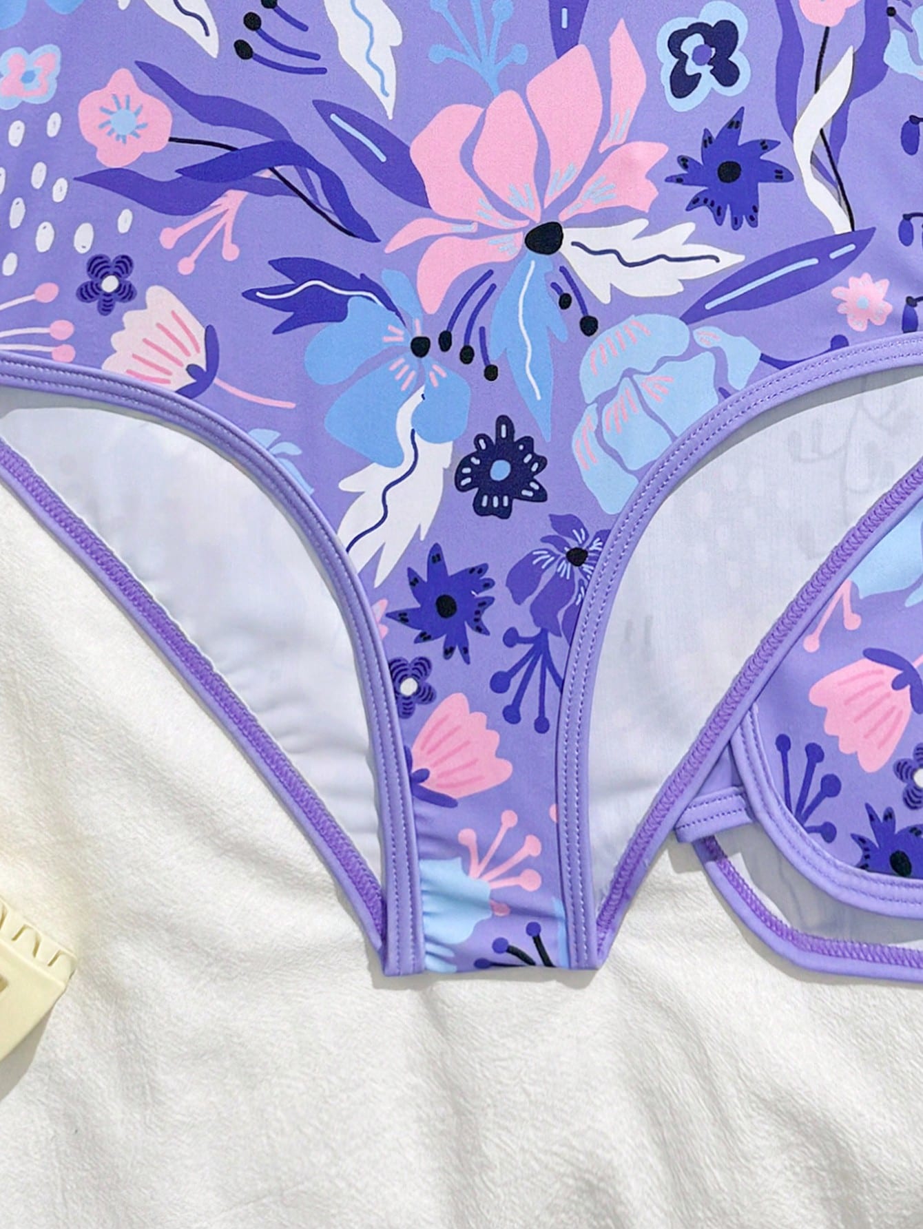 Girls 2-piece swimwear set featuring a butterfly print halter swimsuit top and separate mid-waist shorts in multicolor.