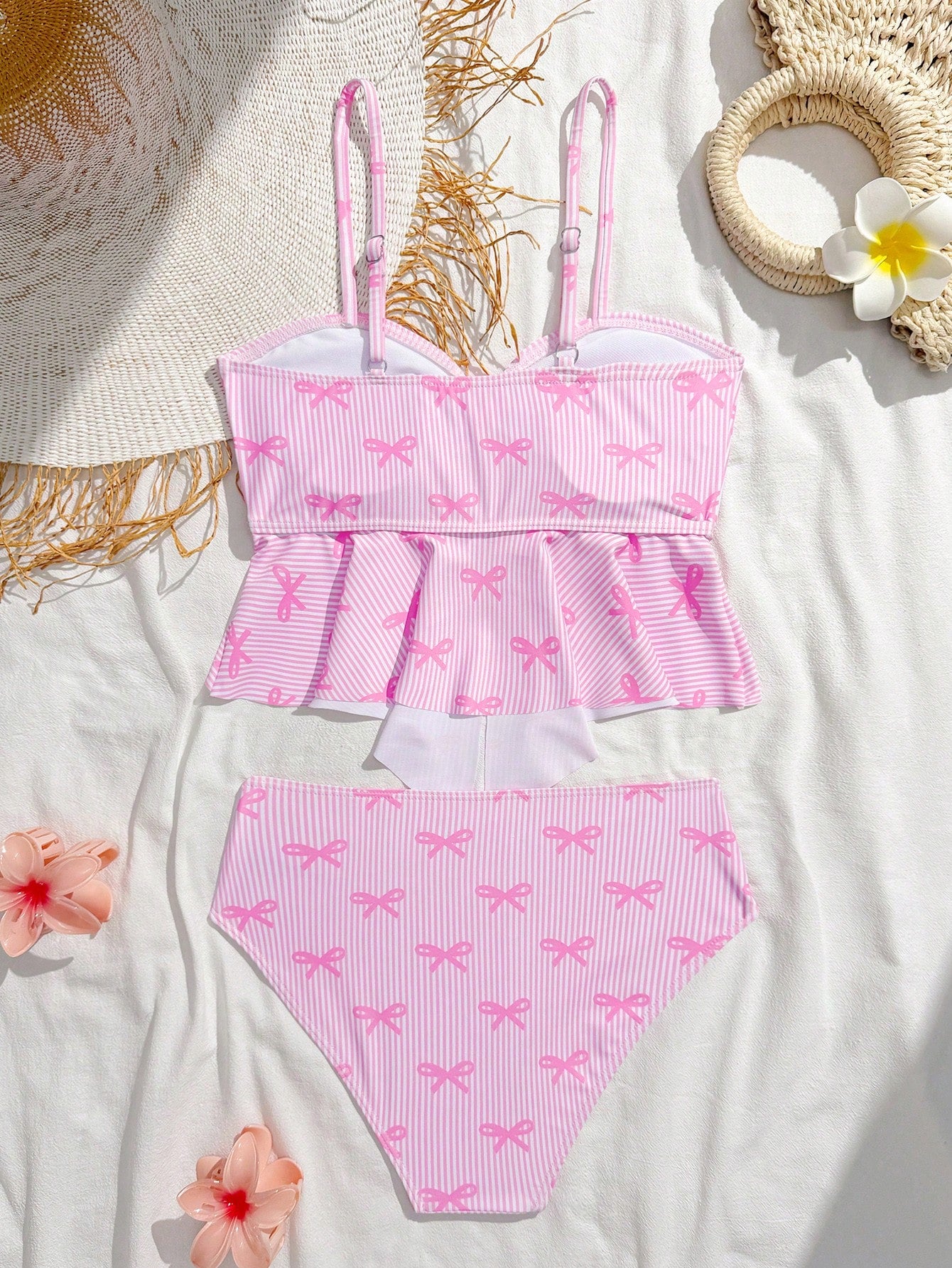 Tween girls two-piece tankini swimwear set with spaghetti straps, asymmetrical design, and 3D rose detail. Features a plant-pattern top and mid-waist bottoms in stretchy fabric for beach or pool wear.