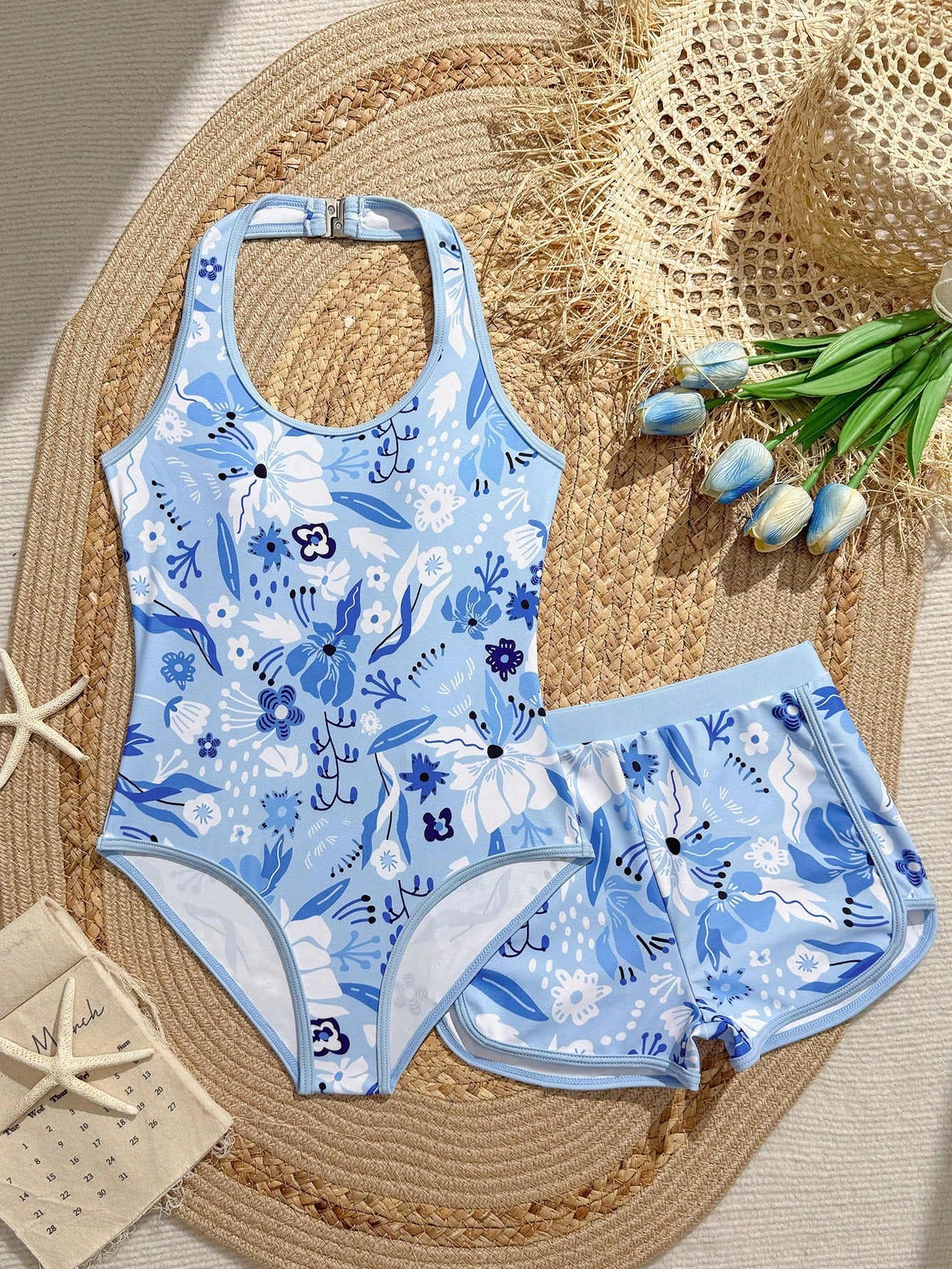 Girls 2-piece swimwear set featuring a butterfly print halter swimsuit top and separate mid-waist shorts in multicolor.