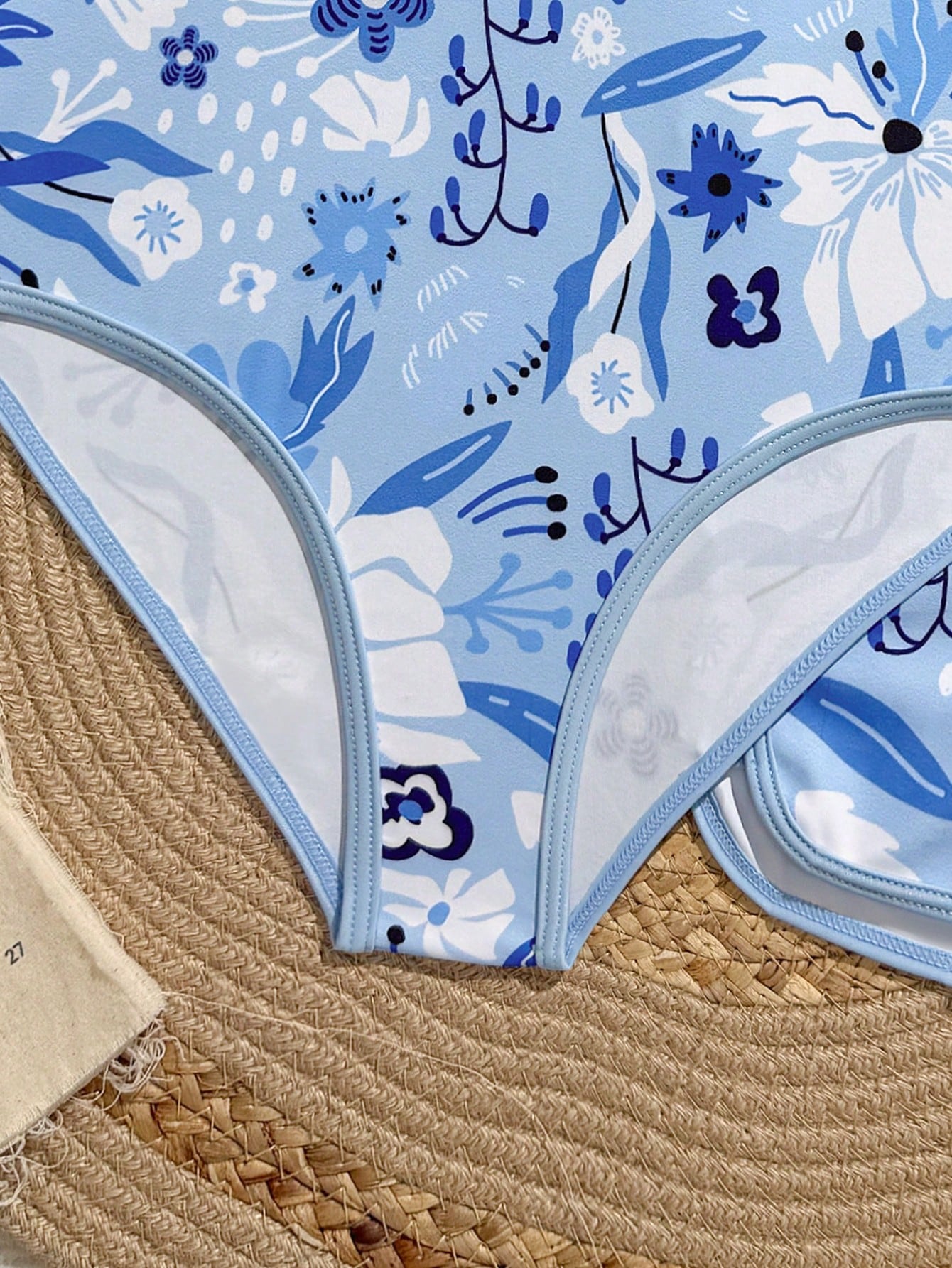 Girls 2-piece swimwear set featuring a butterfly print halter swimsuit top and separate mid-waist shorts in multicolor.