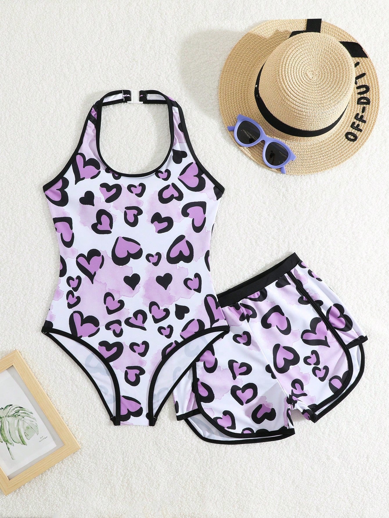 Girls 2-piece swimwear set featuring a butterfly print halter swimsuit top and separate mid-waist shorts in multicolor.