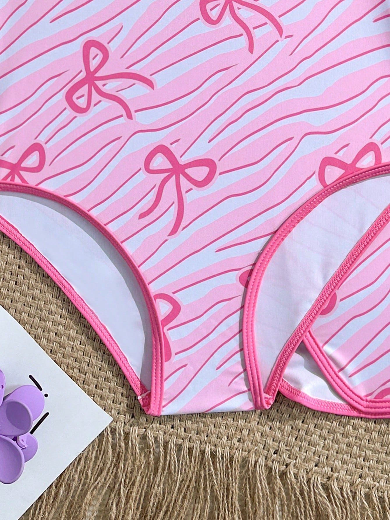 Girls 2-piece swimwear set featuring a butterfly print halter swimsuit top and separate mid-waist shorts in multicolor.