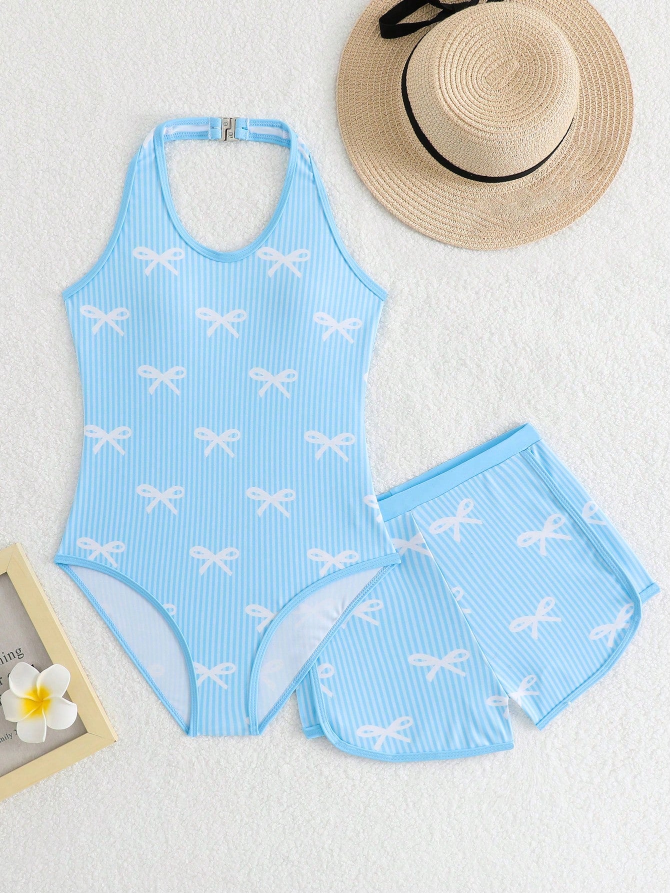 Girls 2-piece swimwear set featuring a butterfly print halter swimsuit top and separate mid-waist shorts in multicolor.