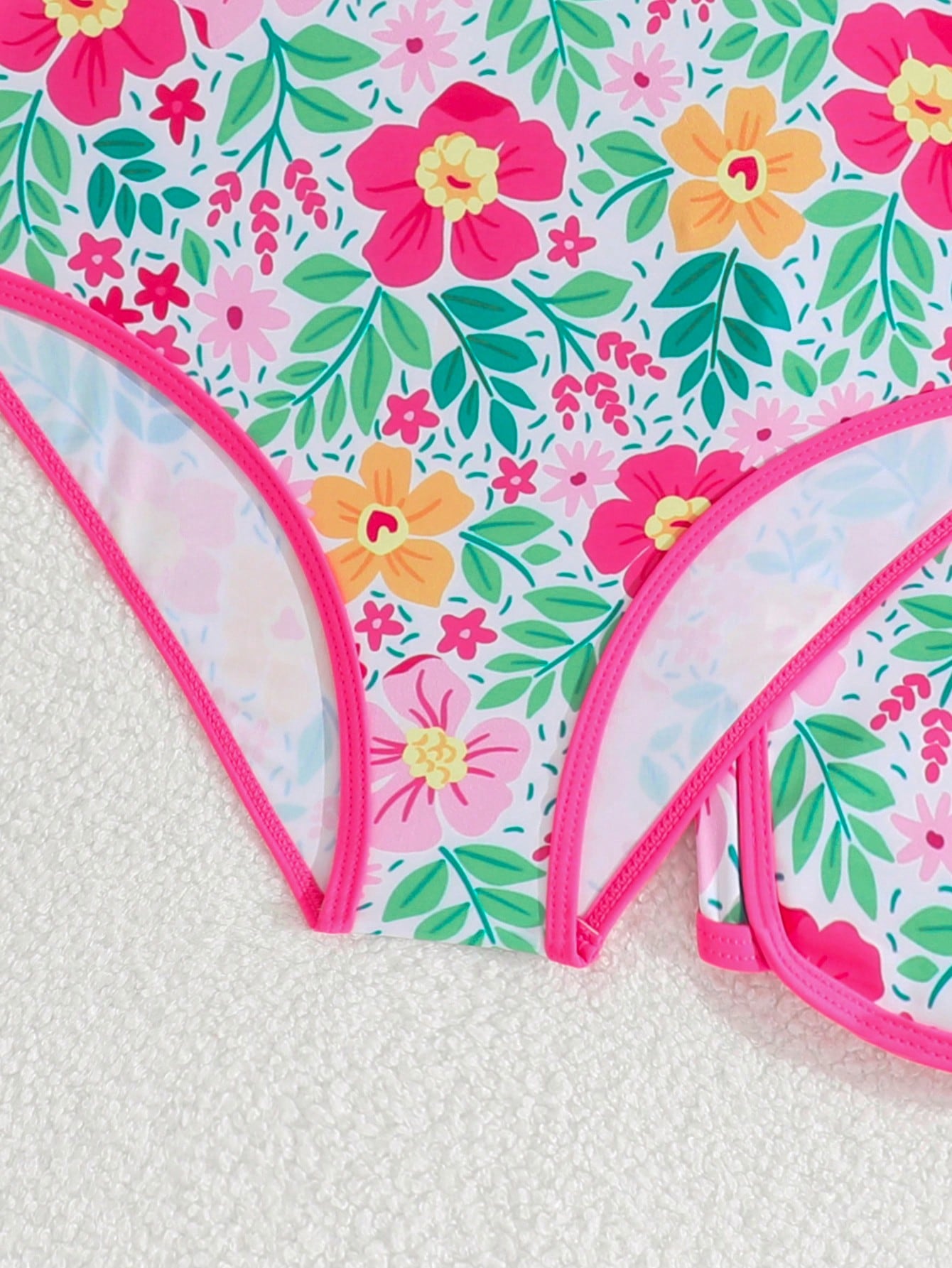 Girls 2-piece swimwear set featuring a butterfly print halter swimsuit top and separate mid-waist shorts in multicolor.